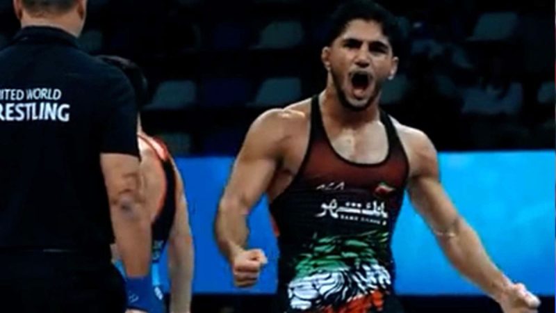 فریاد شادی کشتی گیر ایرانی بعد از باختن به حریف آمریکایی!