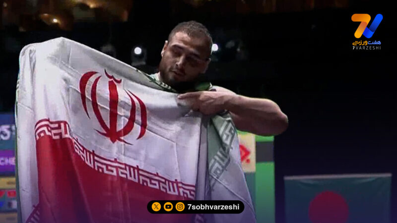 دور افتخار فردین هدایتی با پرچم ایران بعد از کسب مدال طلا 